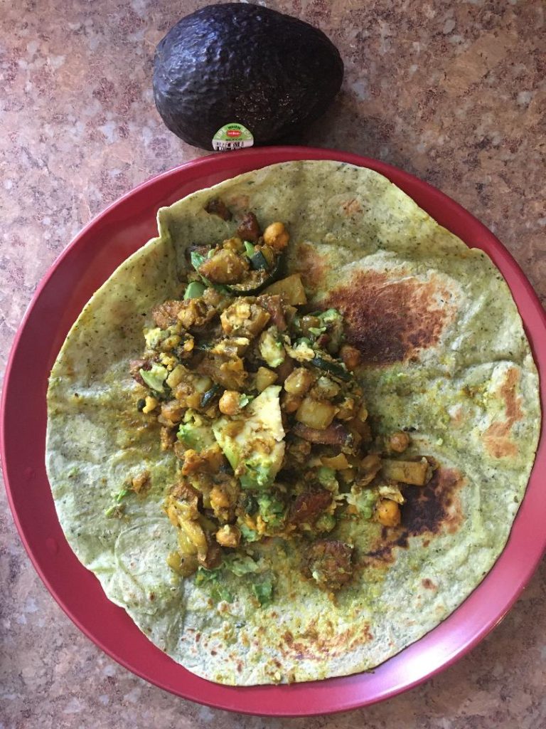 Photo Of My Avocado Breakfast With Curried Chickpeas and Various Ingredients Wrapped in a Tortilla