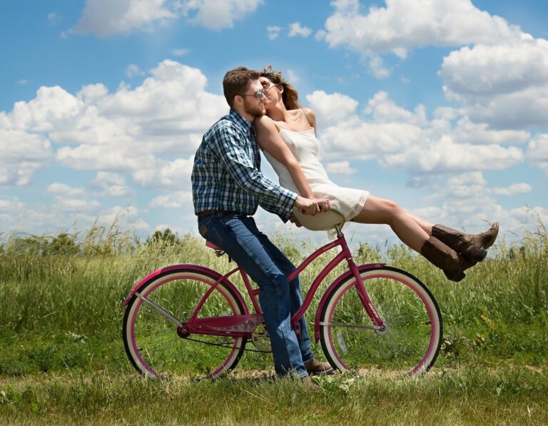 Shows a young couple riding a bicycle when they first started dating.